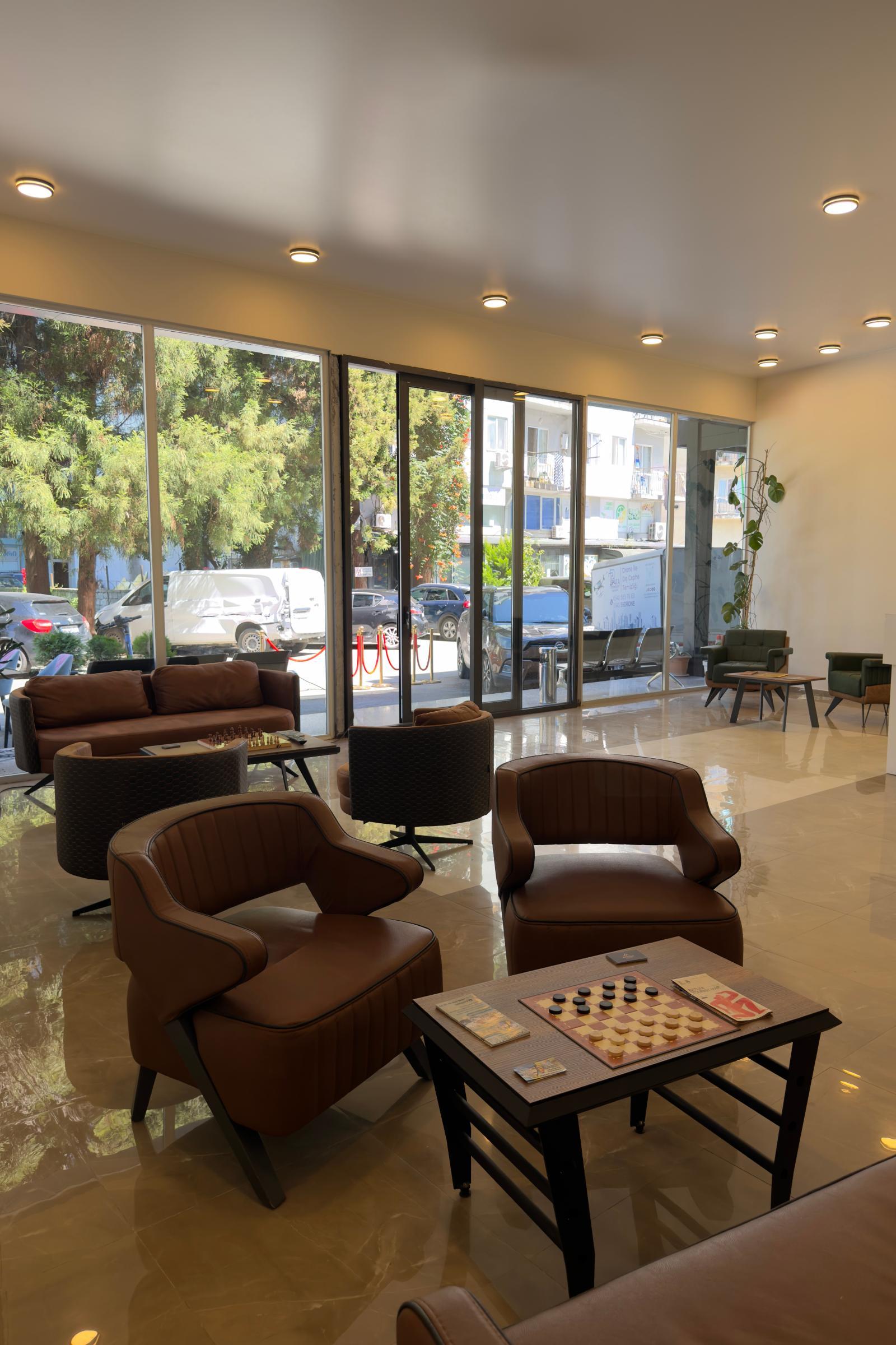 Warm lounge interior at Akman Swiss Hotel in the city center